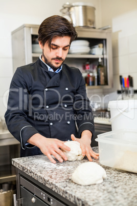 Chef tossing dough while making pastries