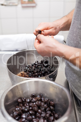 Chef preparing ingredients in a commercial kitchen