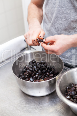 Chef preparing ingredients in a commercial kitchen