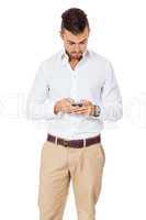 Handsome man reading a message on his mobile