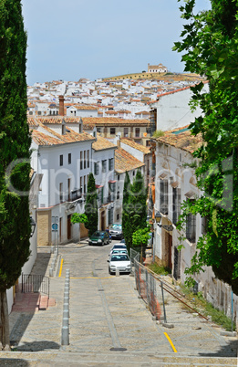Steep street of Spanish white town Antequera