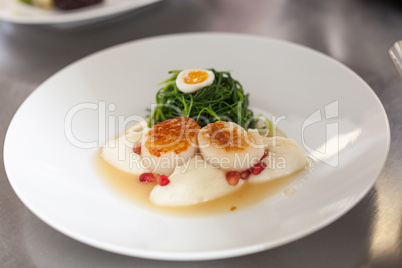 Delicious starter of stuffed savoury eggs and scallops