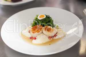 Delicious starter of stuffed savoury eggs and scallops