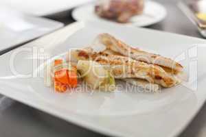 Fried fish fillets and vegetables