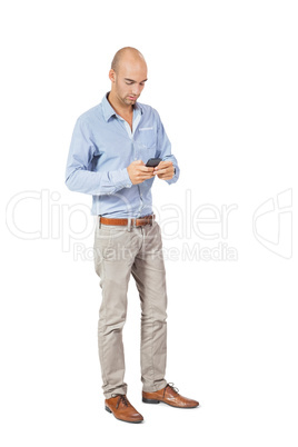 Handsome man reading a message on his mobile