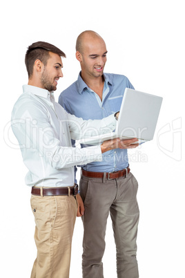 Two businessmen consulting a laptop