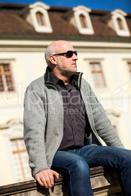 Stylish man in sunglasses enjoying the sun