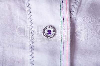 Closeup Small Buttons on White Cloth