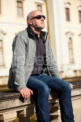 Stylish man in sunglasses enjoying the sun