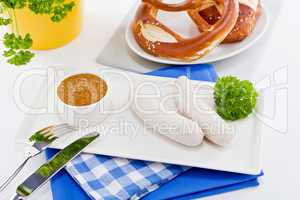 weisswurst white sausages and sweet mustard with pretzel