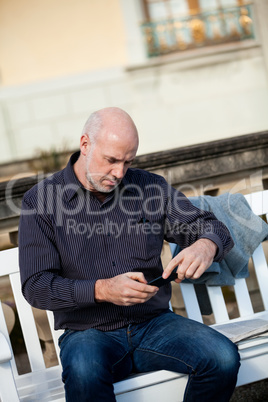 Man checking a photo on his mobile phone