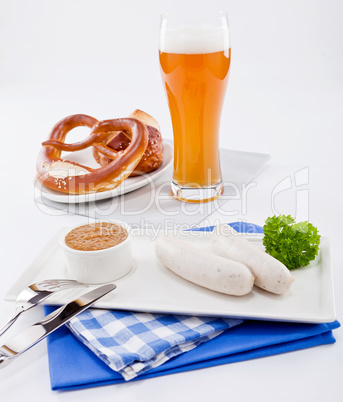 weisswurst white sausages and sweet mustard with pretzel