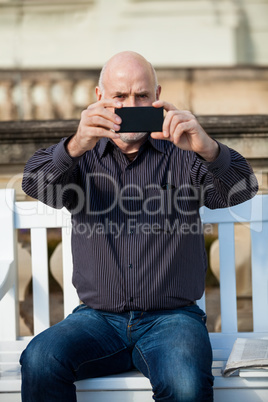 Man taking a photograph with his mobile