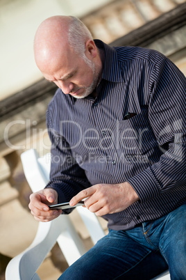 Man checking a photo on his mobile phone