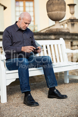 Man checking a photo on his mobile phone