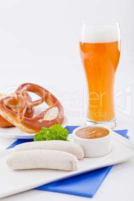 weisswurst white sausages and sweet mustard with pretzel