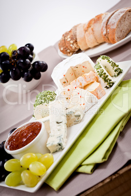 cheese plate with grapes and wine dinner