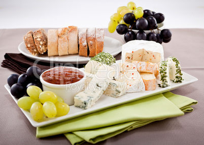 cheese plate with grapes and wine dinner