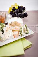 cheese plate with grapes and wine dinner