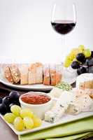 cheese plate with grapes and wine dinner