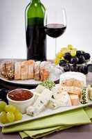 cheese plate with grapes and wine dinner