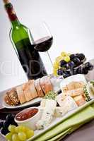 cheese plate with grapes and wine dinner