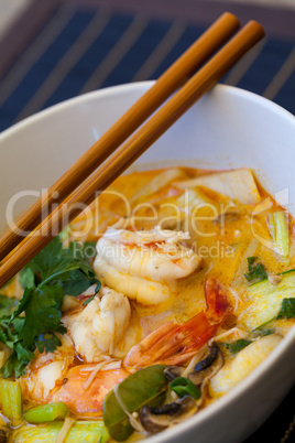 Bowl of traditional Thai tom yam soup