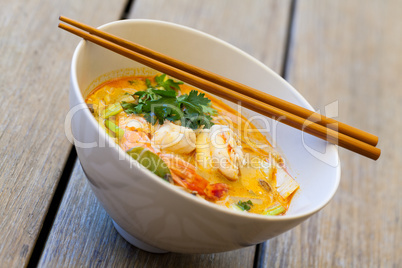 Bowl of traditional Thai tom yam soup