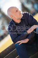 Thoughtful man sitting on a flight of steps