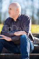 Thoughtful man sitting on a flight of steps