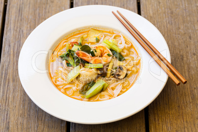 Bowl of traditional Thai tom yam soup