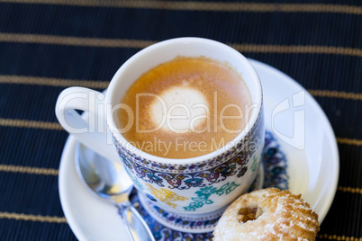 Cup of freshly brewed tea and a cookie