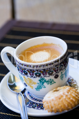 Cup of freshly brewed tea and a cookie