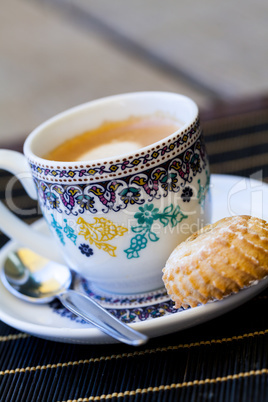 Cup of freshly brewed tea and a cookie