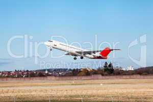 Passenger airliner taking off at an airport