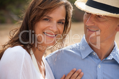 happy adult couple in summertime on beach