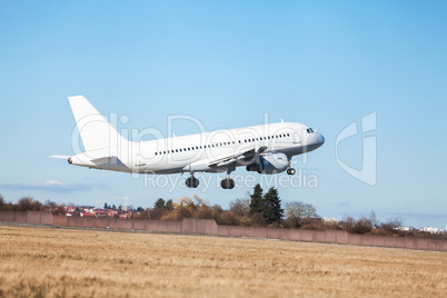 Passenger airliner taking off at an airport