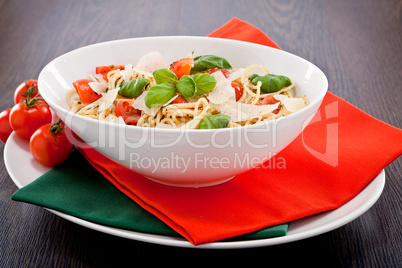 fresh tasty pasta spaghetti with tomatoes and basil