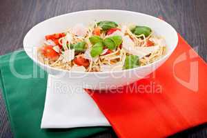 fresh tasty pasta spaghetti with tomatoes and basil