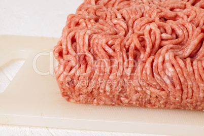 Block of commercial beef mince from a store
