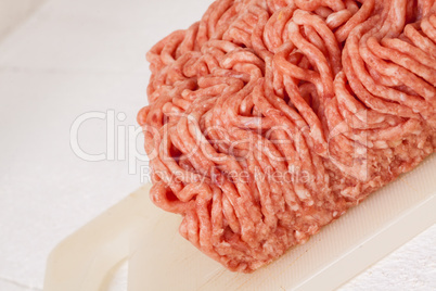 Block of commercial beef mince from a store