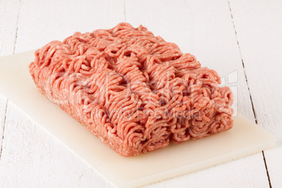 Block of commercial beef mince from a store