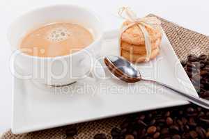 fresh aromatic coffee and cookies on table