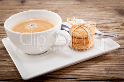 fresh aromatic coffee and cookies on table