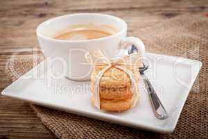 fresh aromatic coffee and cookies on table