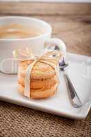 fresh aromatic coffee and cookies on table