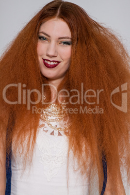 Female model playing with frizzy hair