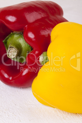 Red and Yellow Peppers on White Background