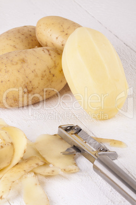 Potatoes with Peeler and Peeled Skin