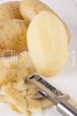 Potatoes with Peeler and Peeled Skin